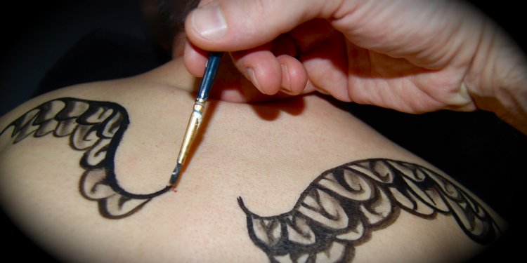 Painting temporary ink tattoos